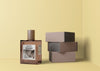 Perfume Beside Stack Of Boxes Psd