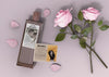 Perfume Bottle And Roses Beside Psd