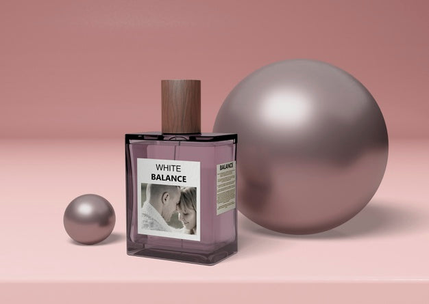 Perfume Bottle Beside Balls On Table Psd