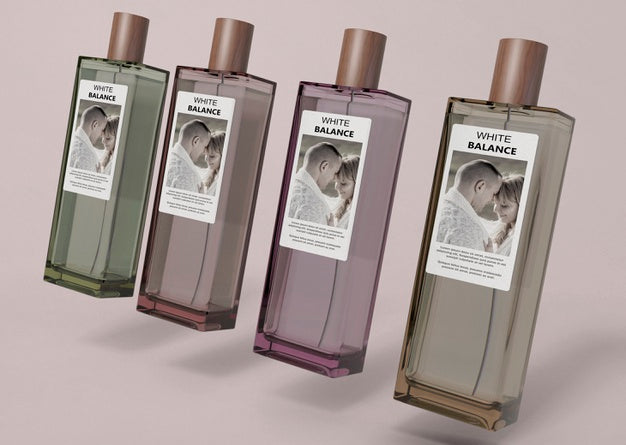 Perfume Bottles Aligned On Table Psd