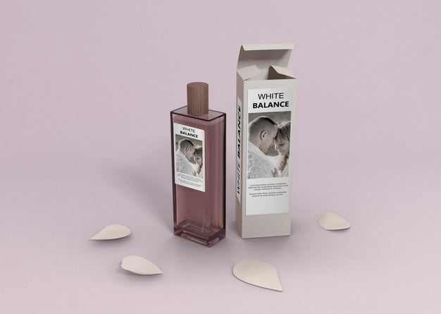 Perfume Container On Table With Petals Psd