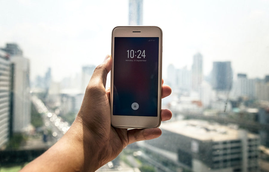 Person Checking The Time On Phone