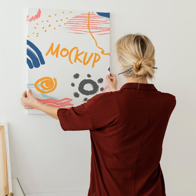 Person Holding A Canvas Mock-Up Psd