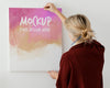 Person Holding A Canvas Mock-Up Psd