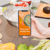 Person Holding A Mobile Phone Healthy Food Mock-Up Psd