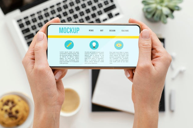 Person Holding A Mock-Up Smartphone Psd