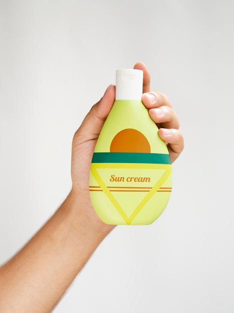 Person Holding A Sun Cream Bottle Psd