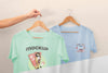 Person Holding Japanese T-Shirts Mock-Up Psd