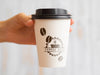 Person Holding Up A Coffee Paper Cup Psd