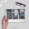 Person Reading A Newspaper With A Glasses On The Desktop Psd