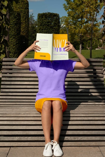 Person Reading Color Pop Magazine With Cover Mockup Psd