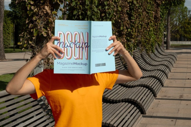 Person Reading Color Pop Magazine With Cover Mockup Psd