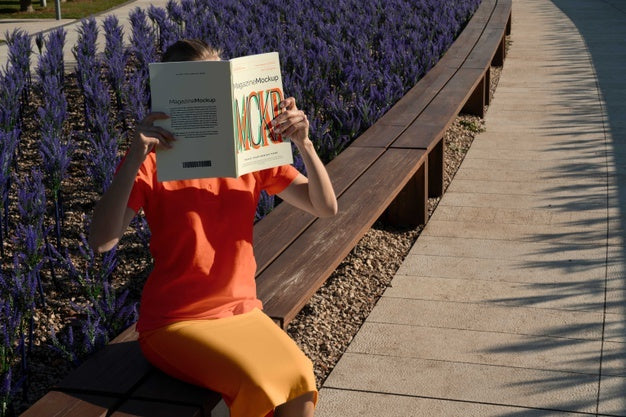 Person Reading Color Pop Magazine With Cover Mockup Psd