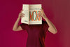 Person Reading Color Pop Magazine With Cover Mockup Psd