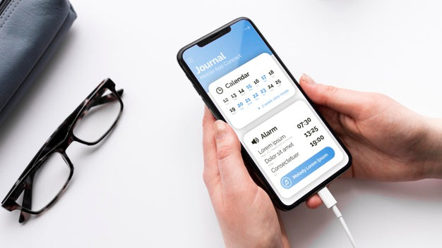 Person With Phone Mock-Up At Desk Psd