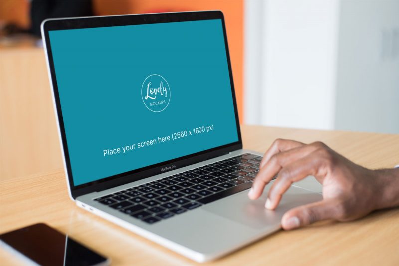 Mockup Of A Person Working On Macbook Pro