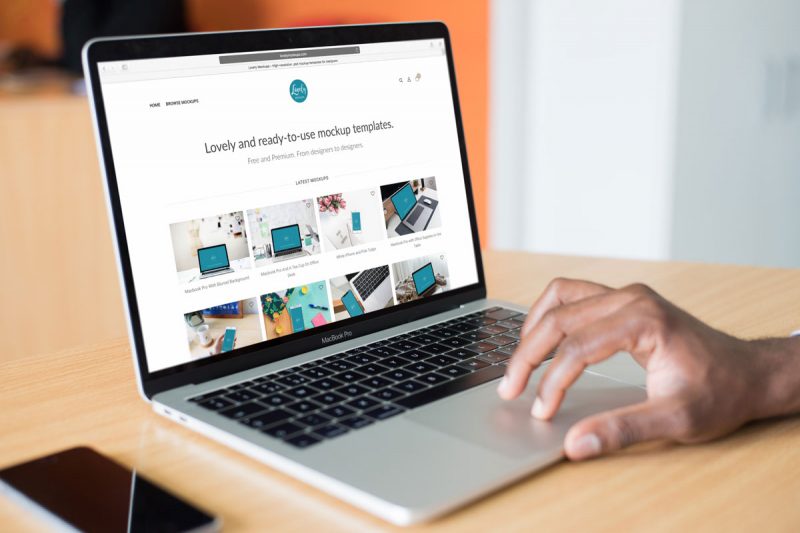 Mockup Of A Person Working On Macbook Pro