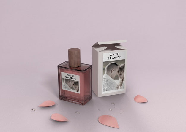 Petals And Perfume Bottle On Table Psd