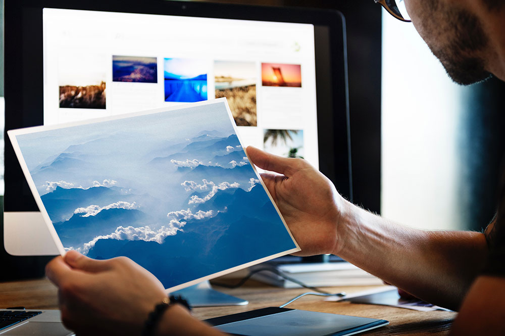Man Holding a Photography or Printing Photo Mockup
