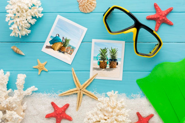 Photos And Swimming Glasses Top View Psd