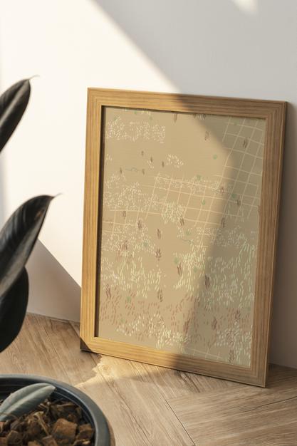 Picture Frame Mockup In Brown Tone With Plant Psd