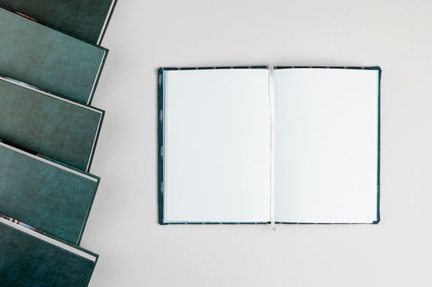 Pile Of Agendas And Open Notebook Psd