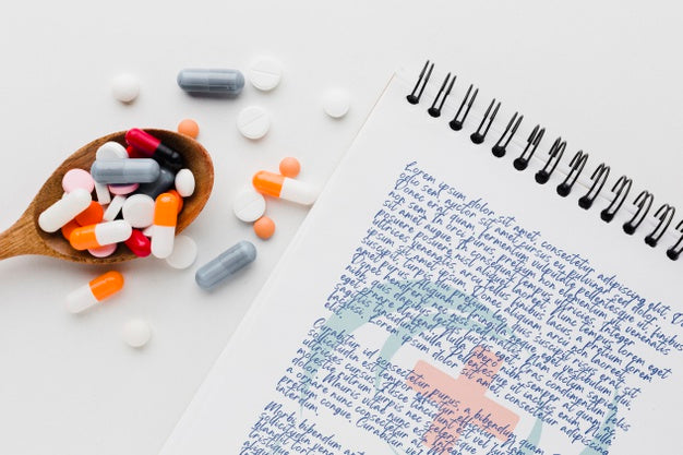 Pills In Wooden Spoon Top View Psd