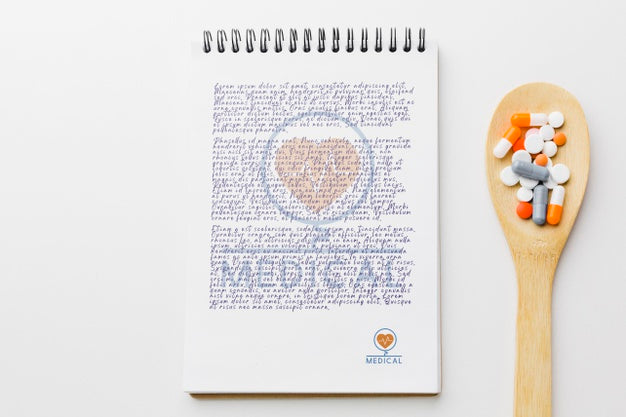 Pills On Wooden Spoon With Notepad Psd