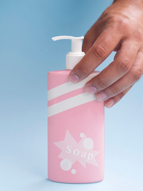 Pink Liquid Soap Bottle On Blue Background Psd