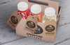 Plastic Bottles Of Organic Smoothie In Cardboard Boxes High View And Labels Psd