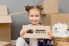 Portrait Of Happy Young Girl Holding Mock-Up Sign Psd