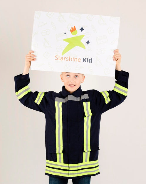 Portrait Of Young Boy Posing As Fireman Psd