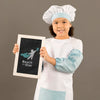Portrait Of Young Girl Posing As Chef Psd