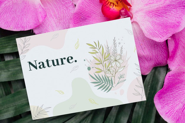 Positive Message On Card Beside Flowers Psd