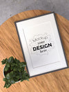 Poster Frame Mockup On Wooden Table Psd