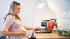 Pregnant Woman Using Laptop Psd