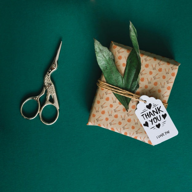 Present Box Mockup With Leaves Psd