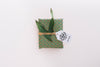 Present Box Mockup With Leaves Psd
