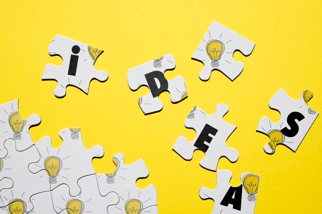 Puzzle Concept With Letters And Light Bulbs Psd