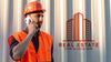 Real Estate Man With Hard Hat Talking On Phone Psd