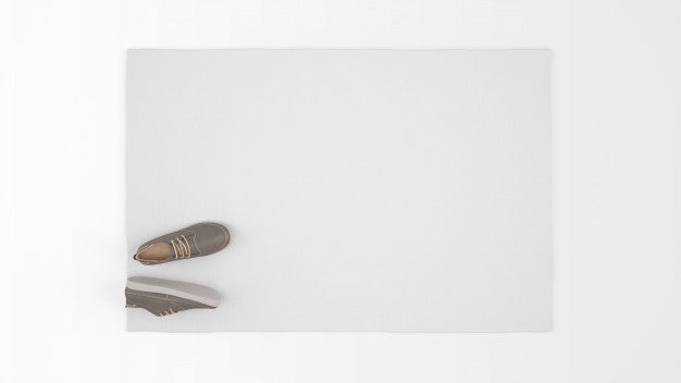 Realistic White Carpet With A Pair Of Shoes On Top View Psd