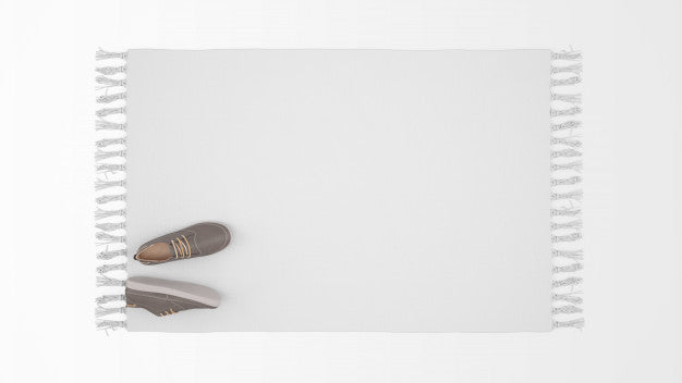 Realistic White Carpet With A Pair Of Shoes On Top View Psd