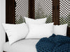 Realistic White Cushions On A Rustic Sofa Psd