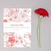 Red Gerbera Flower Placed Next To Card Mockup Psd