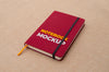 Red Notebook On Fabric Surface Mockup Psd