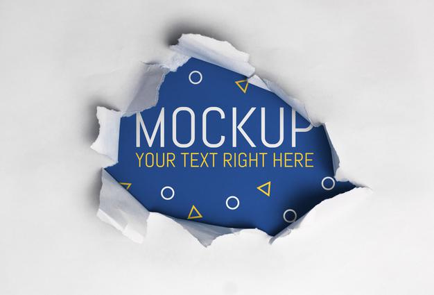 Ripped Paper Over Blue Background Mockup Psd