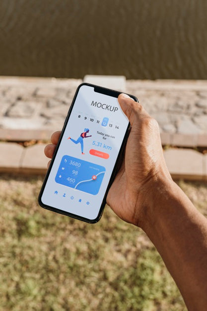 Runner Holding A Mock-Up Smartphone Psd