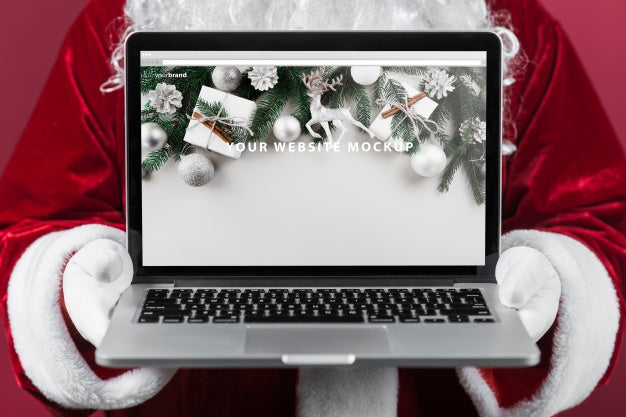 Santa Presenting Laptop Mockup Psd