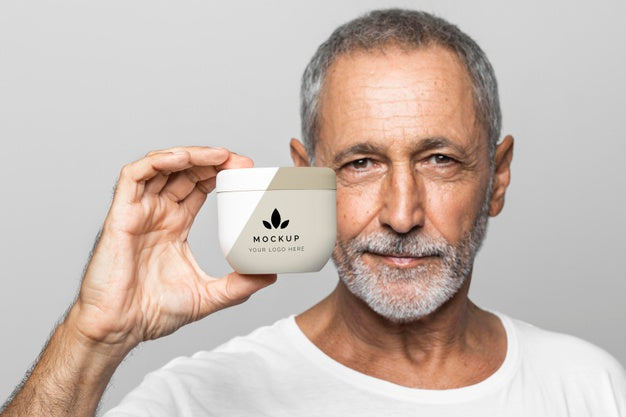 Senior Man Holding Cream Container Psd