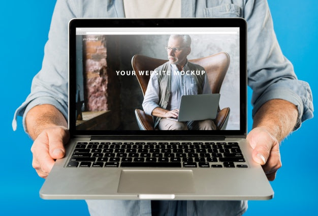 Senior Man Presenting Laptop Mockup Psd